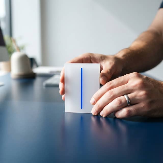 A precision acrylic block on a dark blue surface