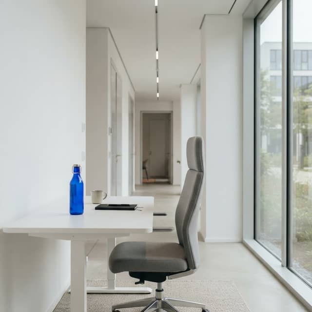 Minimalist modern office workspace with a blue water bottle