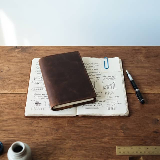 Hand written content on a clean wooden desk