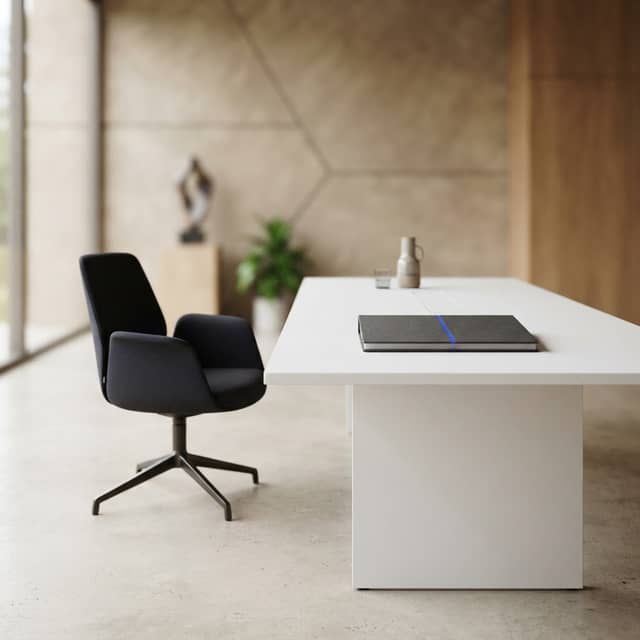 Empty office chair versus professional strategy document